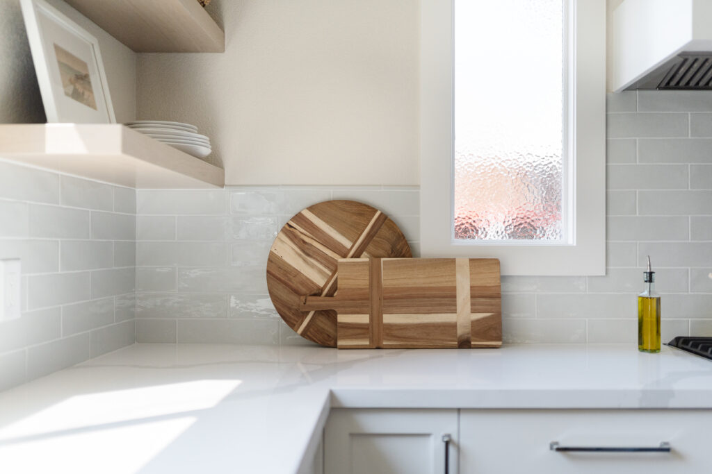 White Kitchen marble countertops subway tile wooden cutting board Jennifer Ramsey Interiors