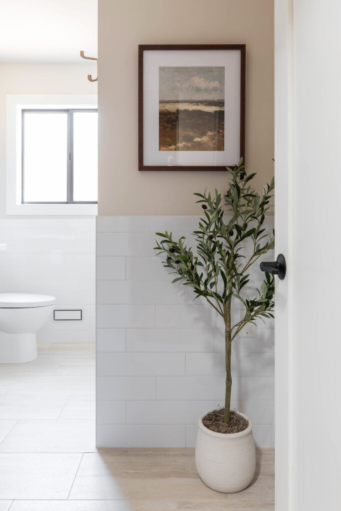 Neutral palette colors for a narrow bathroom to look wider. Olive tree and closet door Sacramento Placer County CA